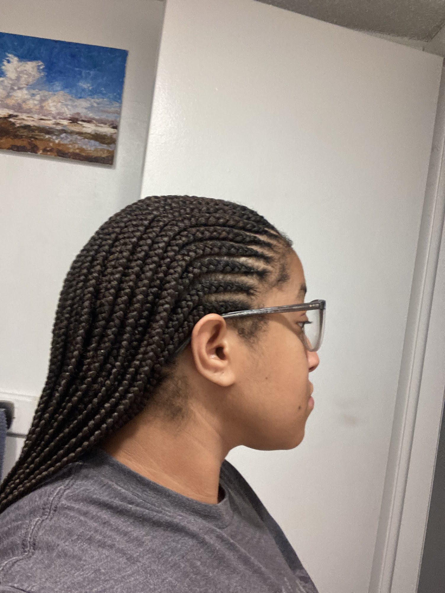 Neat cornrows braided back from the hairline
